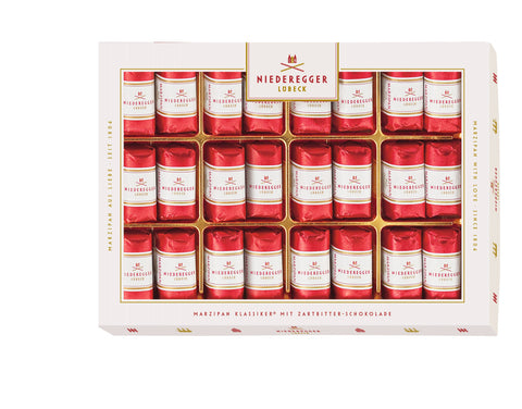 Niederegger Marzipan-Klassiker Geschenkbox, geöffnete Ansicht mit roten Blechdosen im Raster