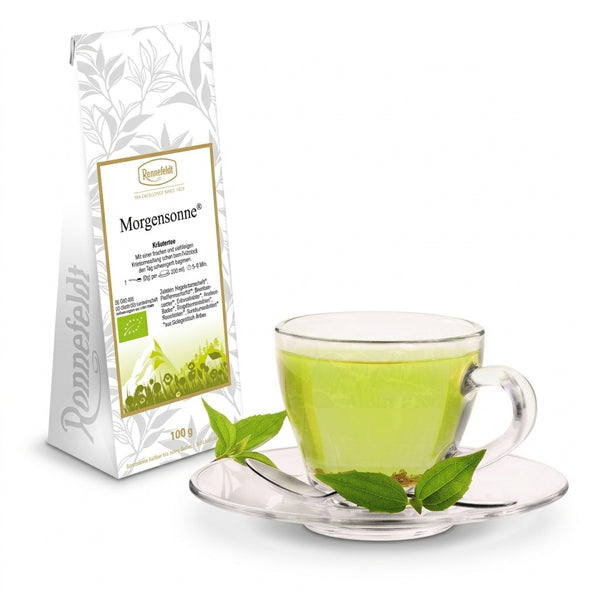 Ronnefeldt BIO Kräutertee Morgensonne, Tee-Packung mit grüner Tasse auf Untertasse